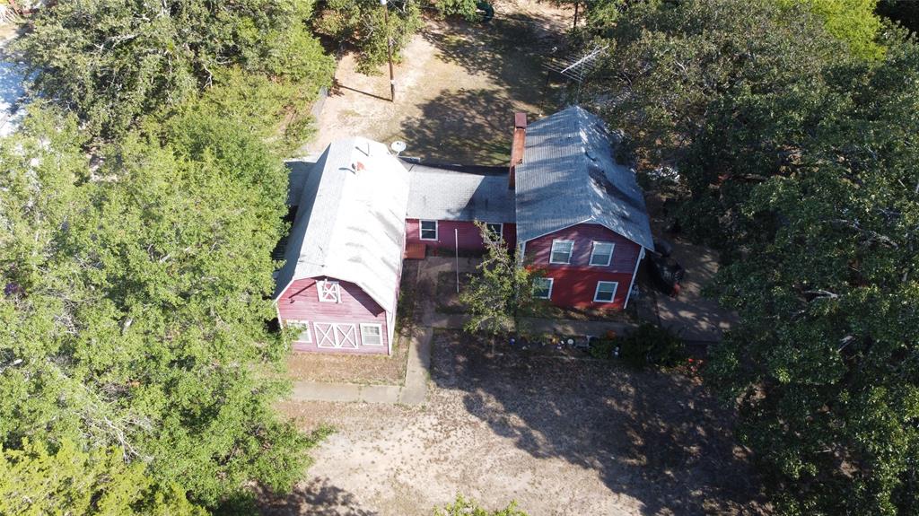 4120 Interstate 30 Campbell, TX 75422 - Photo 36 of 36 a view of a house with a yard and garage