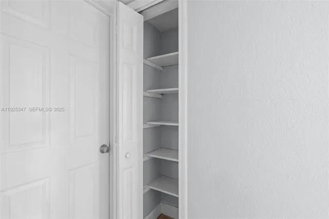 a view of an empty walk in closet