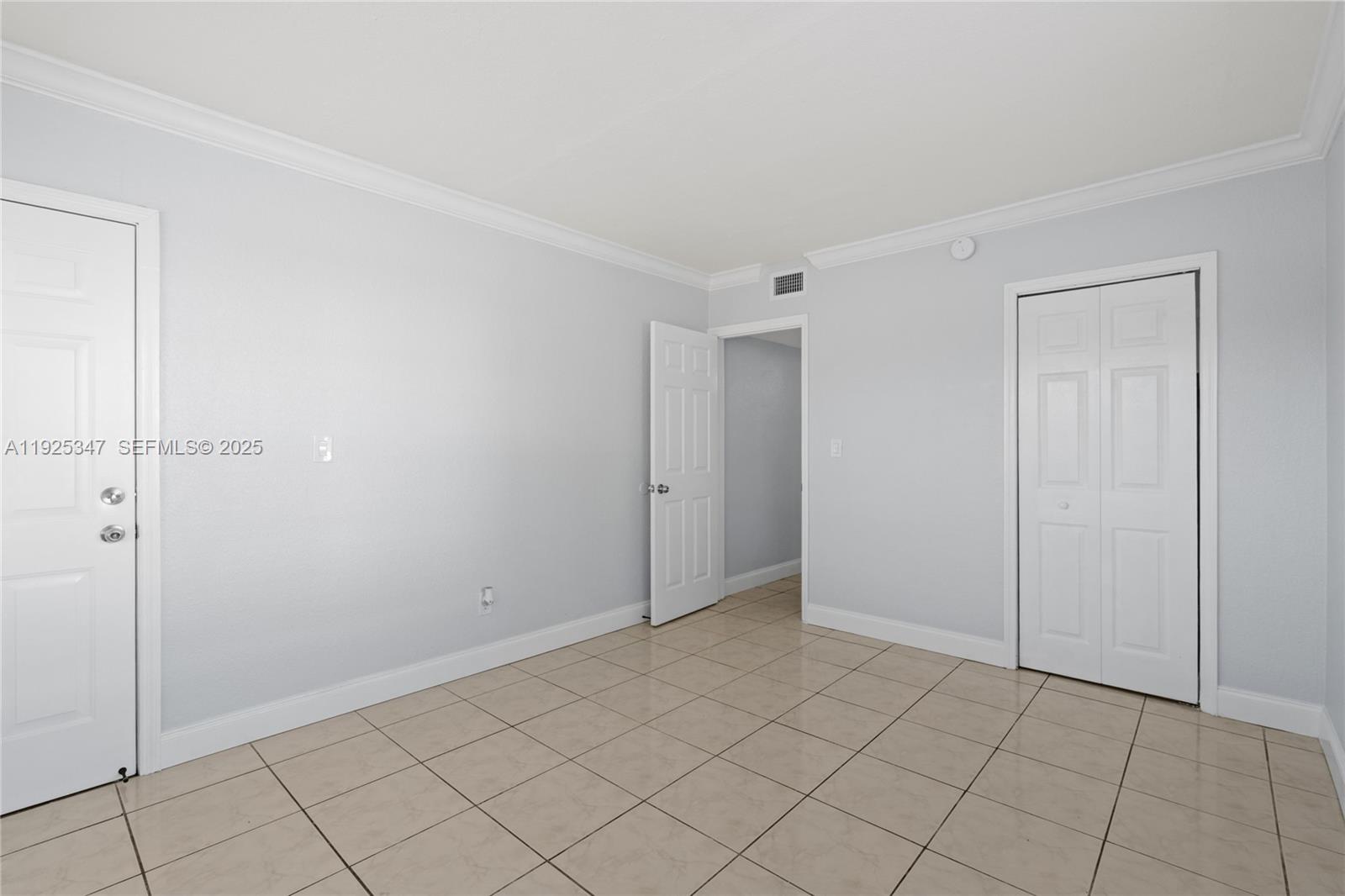 980 Northeast 170th Street, Unit 118 North Miami Beach, FL 33162 - Photo 19 of 32 a view of an empty room