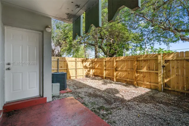 a view of a backyard of the house