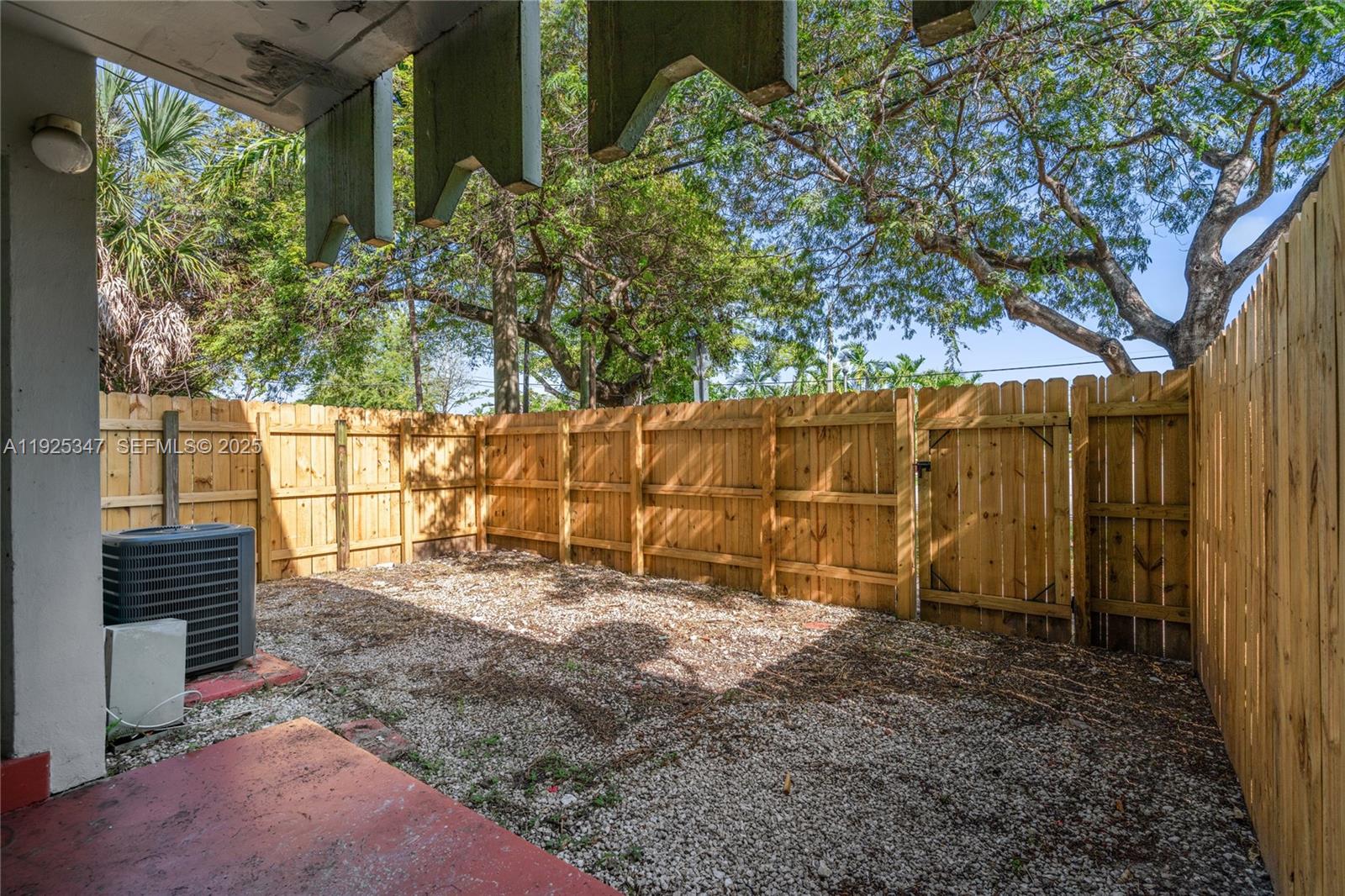 980 Northeast 170th Street, Unit 118 North Miami Beach, FL 33162 - Photo 25 of 32 a view of backyard with green space