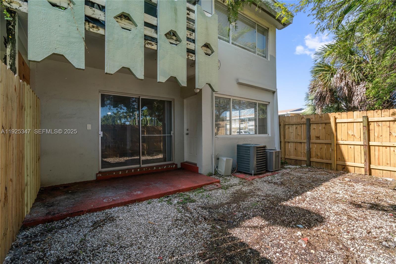 980 Northeast 170th Street, Unit 118 North Miami Beach, FL 33162 - Photo 26 of 32 a view of a front door and outdoor space