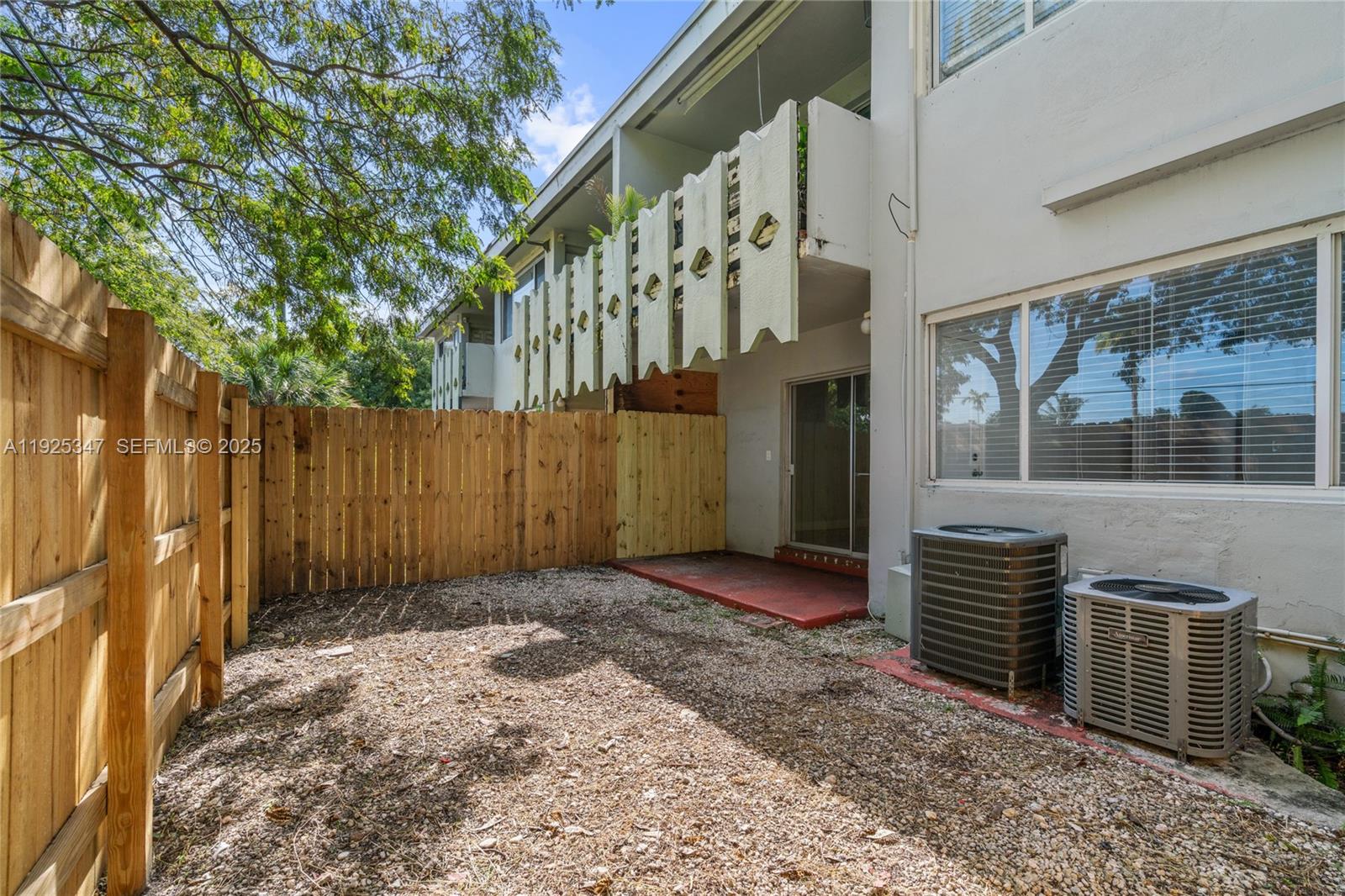 980 Northeast 170th Street, Unit 118 North Miami Beach, FL 33162 - Photo 28 of 32 a view of entrance gate of a house