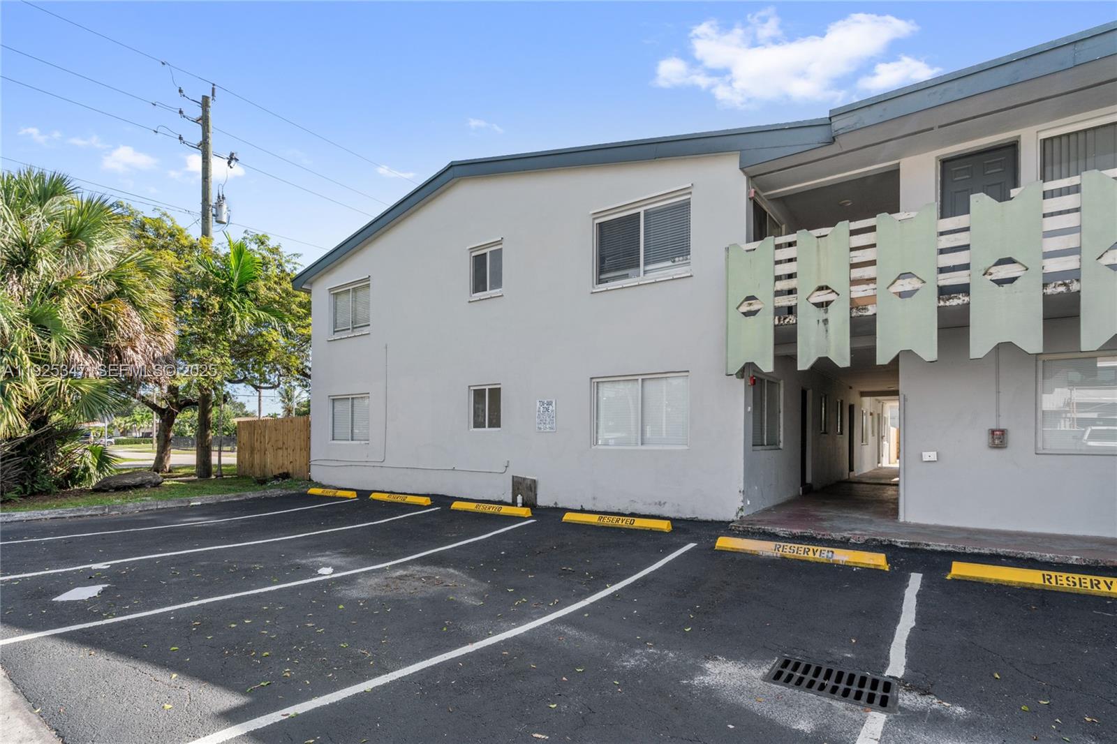 980 Northeast 170th Street, Unit 118 North Miami Beach, FL 33162 - Photo 31 of 32 a view of a building with car parked