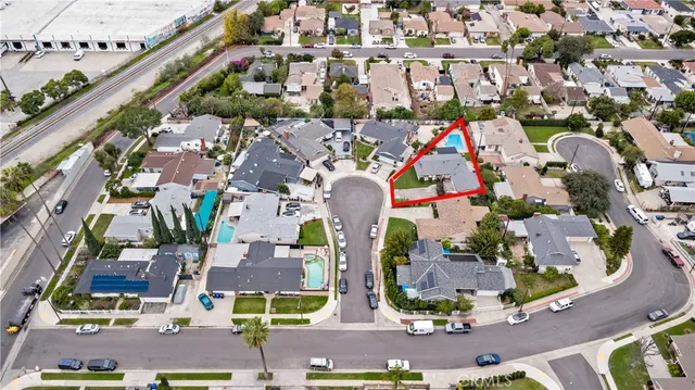 an aerial view of multiple houses with yard