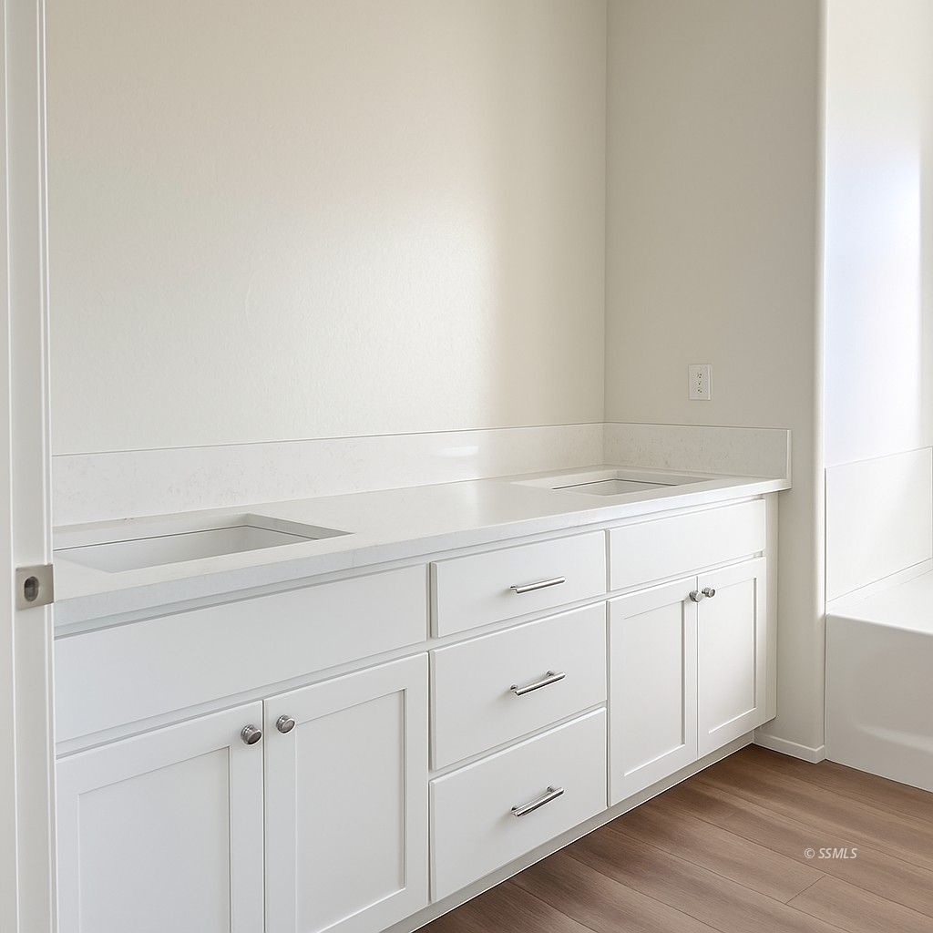 1751 South Mahan Street Ridgecrest, CA 93555 - Photo 11 of 15 a view white cabinets and wooden floor