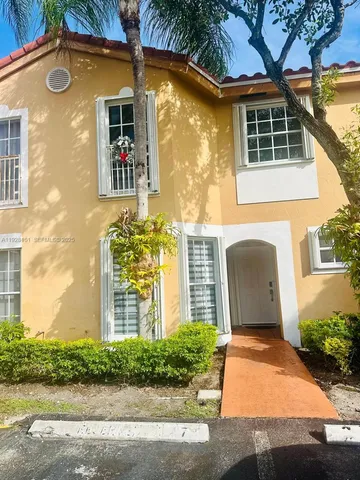 a front view of a house having yard