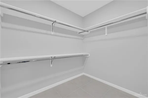 a view of an empty walk in closet