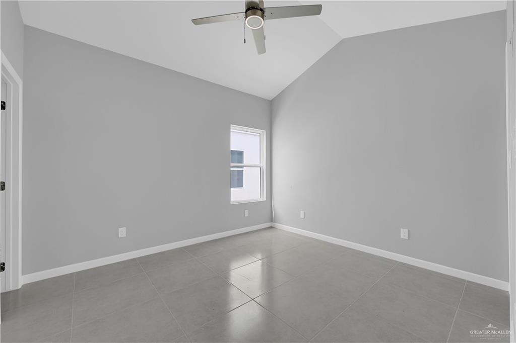 700 Oriole Road, Unit 2 Weslaco, TX 78596 - Photo 10 of 12 an empty room with a window