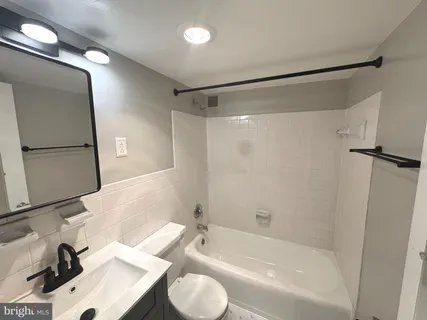 a bathroom with a sink and a bathtub