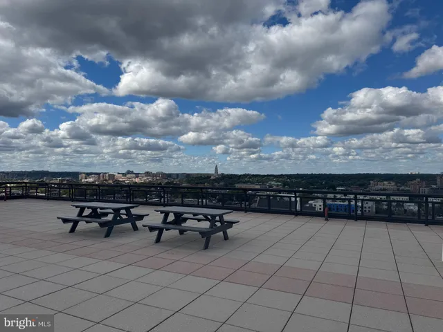 a picture of a bench in front of a wall