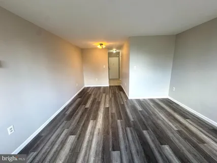a view of wooden floor in an empty room