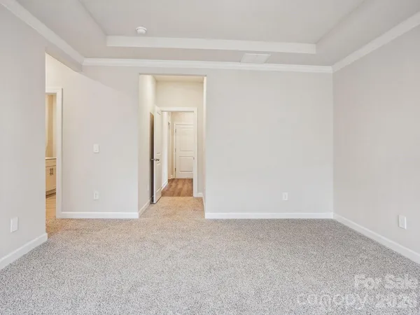 a view of an empty room and closet area