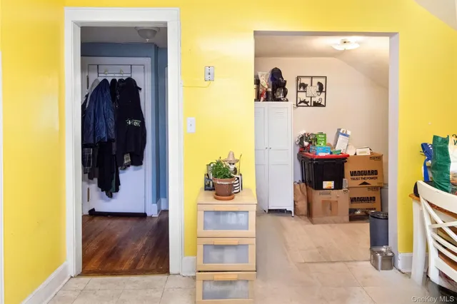 a bedroom with a bed and a flat tv screen