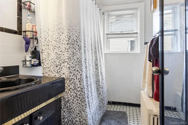 a living room with furniture a rug and a window