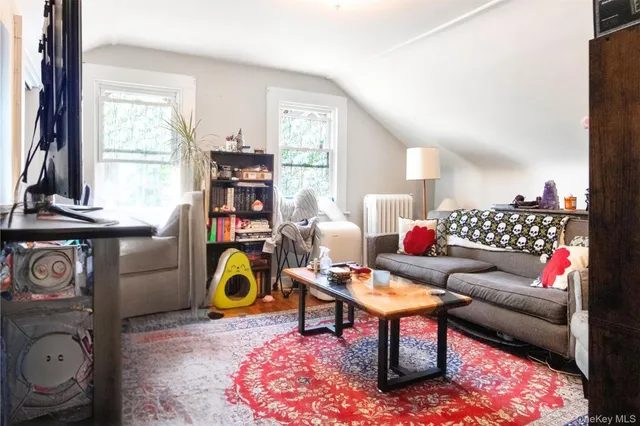 a view of a kitchen with appliances and furniture