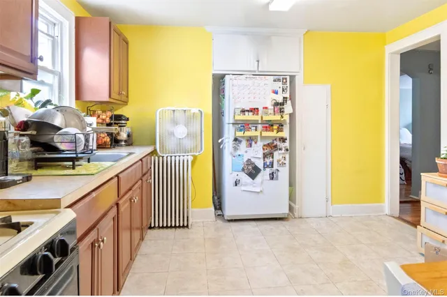 a view of a hallway with workspace and livingroom view
