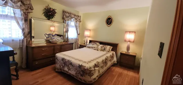 a bedroom with a bed and a dresser