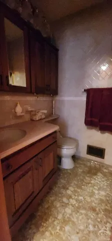 a living room with lots of furniture and a large window