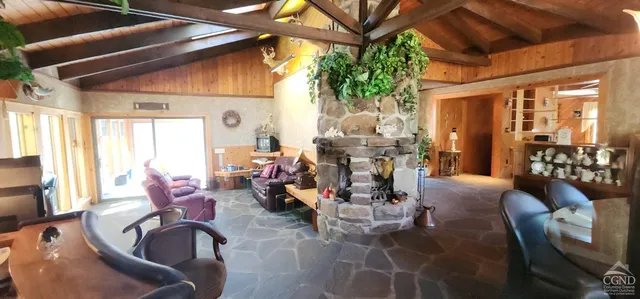a dining room with furniture and window