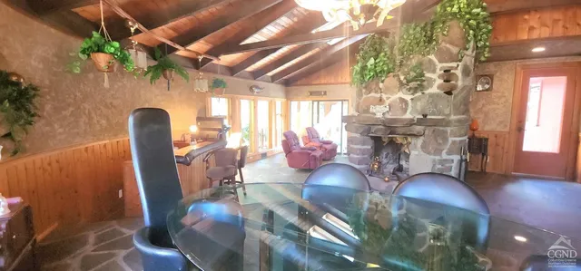 a dining room with furniture and wooden floor