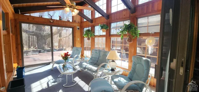 a view of a kitchen with furniture and a window