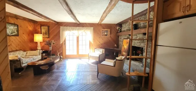 a living room with furniture and a fireplace