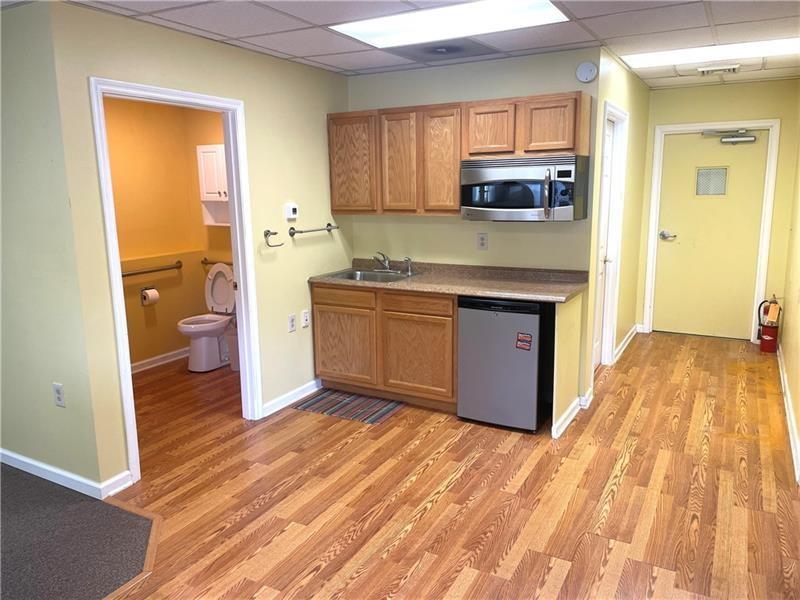 1227 Sunset Drive Butler, PA 16001 - Photo 6 of 13 a kitchen with a sink and a stove top oven