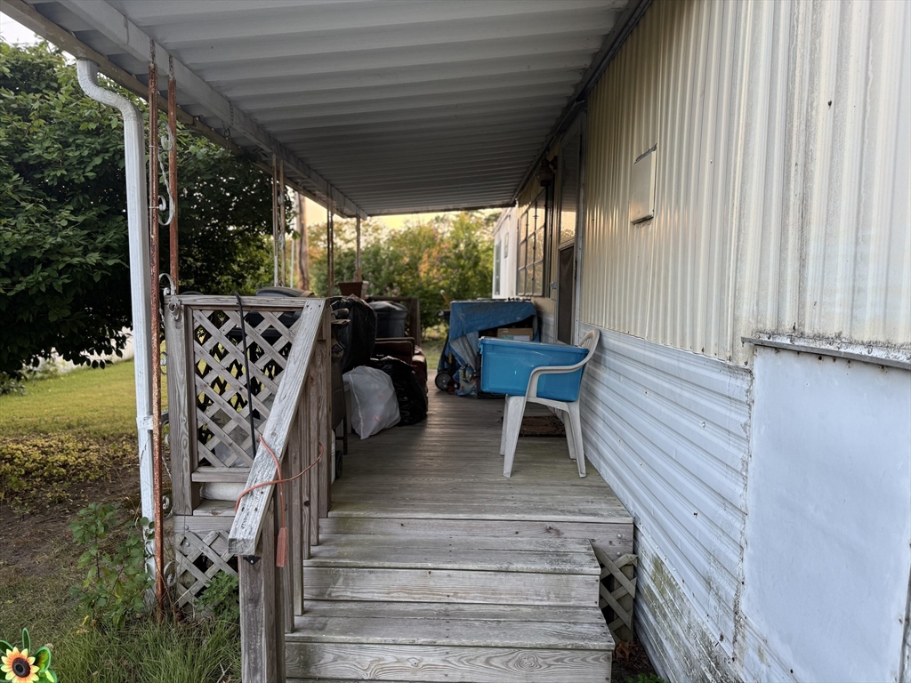 3132 Cranberry Highway, Unit 59 Wareham, MA 02538 - Photo 20 of 22 a view of outdoor space with seating