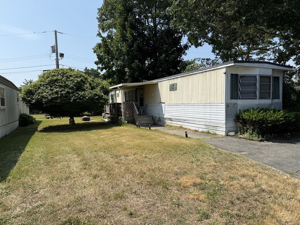 3132 Cranberry Highway, Unit 59 Wareham, MA 02538 - Photo 6 of 22 a view of a backyard
