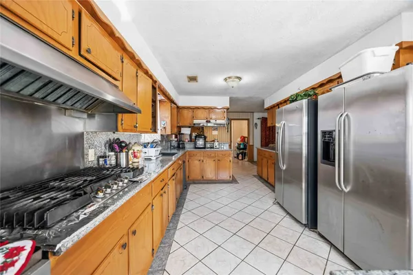 a dining room filled with furniture and a chandelier