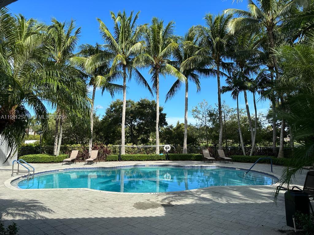 1660 Renaissance Commons Boulevard, Unit 2606 Boynton Beach, FL 33426 - Photo 23 of 26 a view of a yard with palm tree