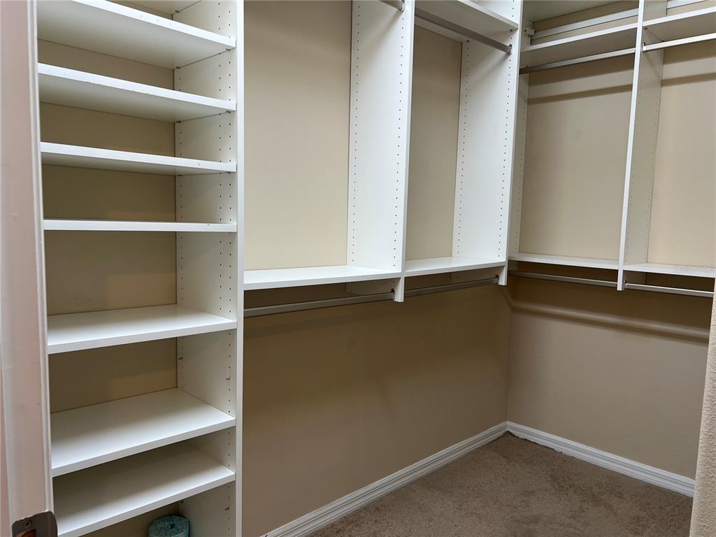 9515 Southwest 76th Street Ocala, FL 34481 - Photo 23 of 55 a view of an empty room with shelf