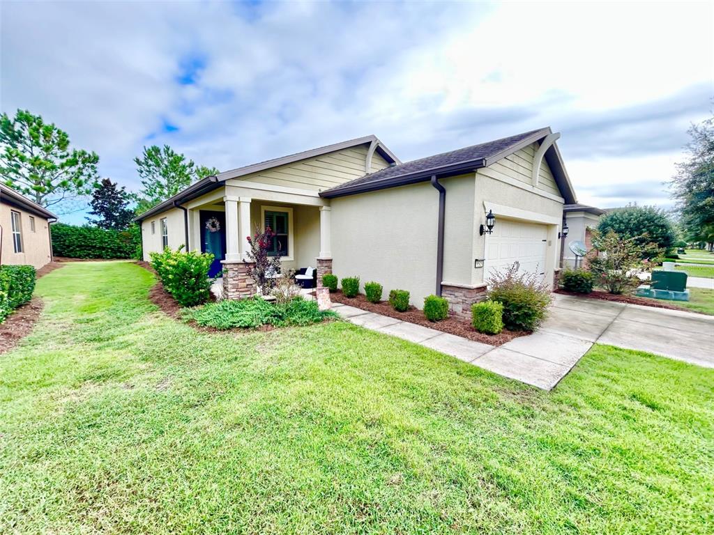 9515 Southwest 76th Street Ocala, FL 34481 - Photo 4 of 55 a front view of house with yard and green space