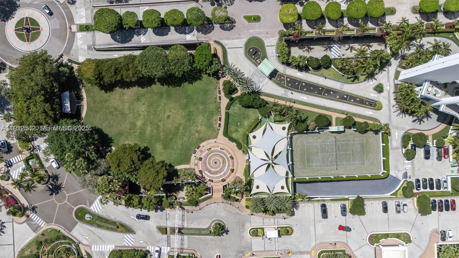 900 Brickell Key Boulevard, Unit 1502 Miami, FL 33131 - Photo 12 of 33 an aerial view of a house a yard and outdoor seating