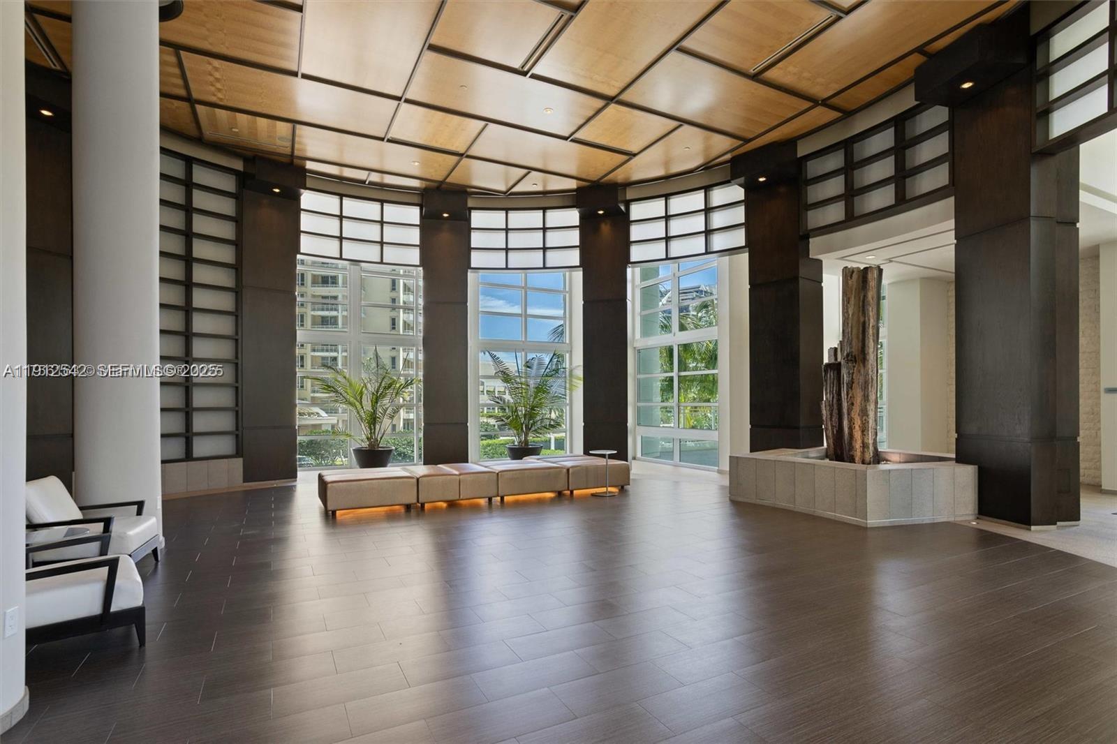 900 Brickell Key Boulevard, Unit 1502 Miami, FL 33131 - Photo 13 of 33 a view of room with hardwood floor and window