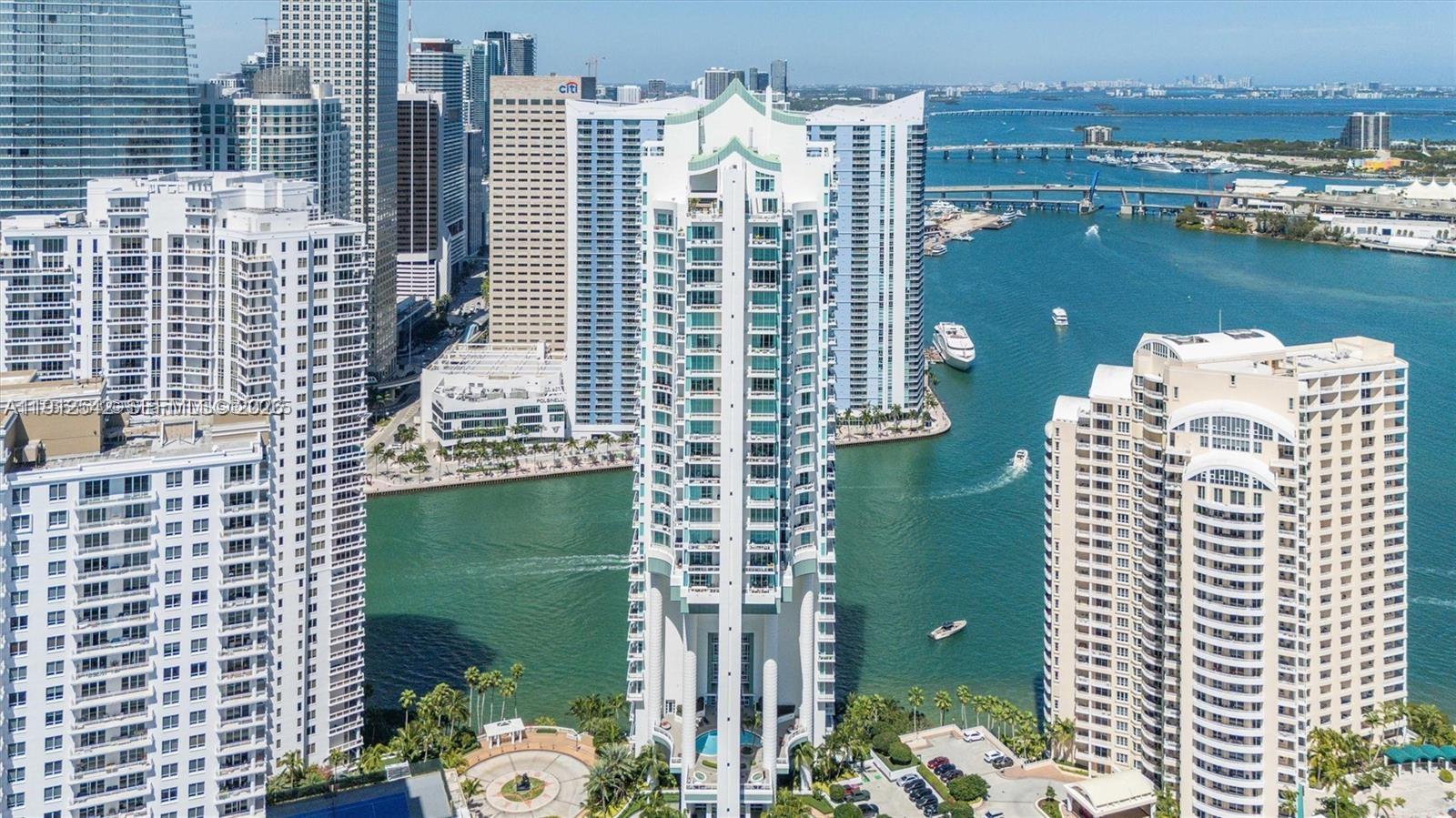 900 Brickell Key Boulevard, Unit 1502 Miami, FL 33131 - Photo 2 of 33 a view of a city with tall buildings