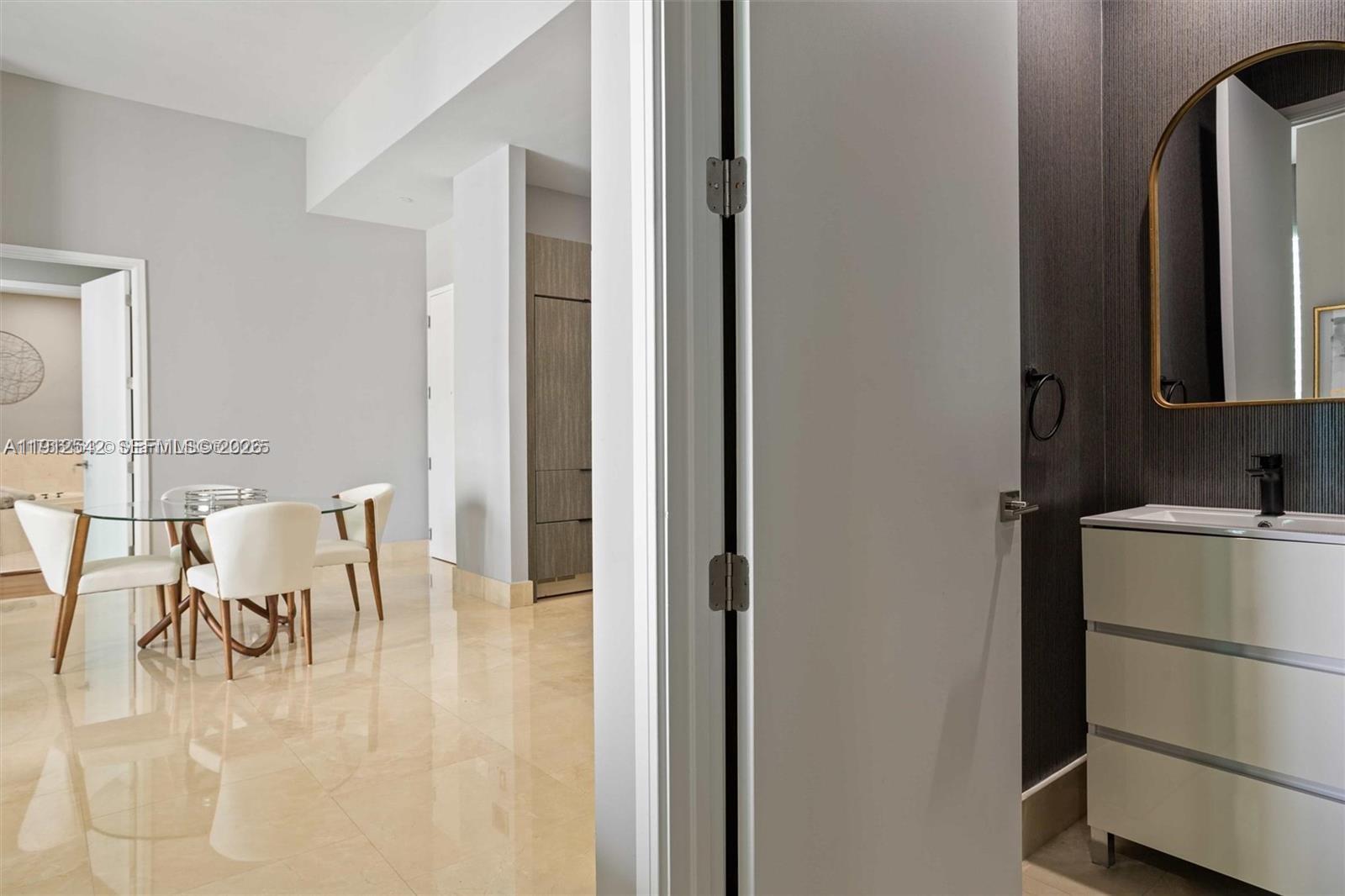 900 Brickell Key Boulevard, Unit 1502 Miami, FL 33131 - Photo 23 of 33 a view of kitchen with furniture and refrigerator