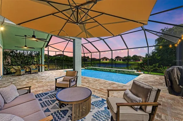a view of a patio with a table chairs and a table