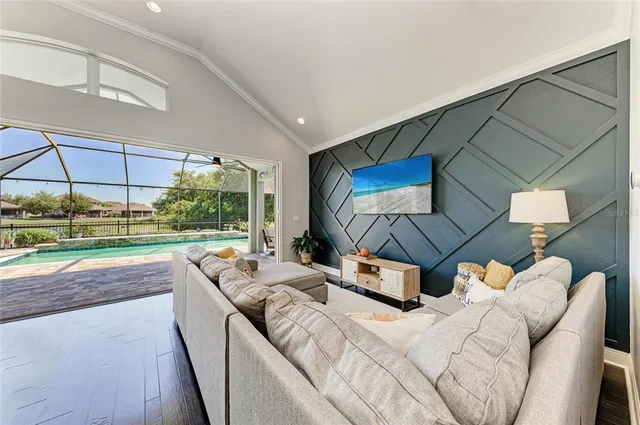 a bed room with a bed and a view of pool