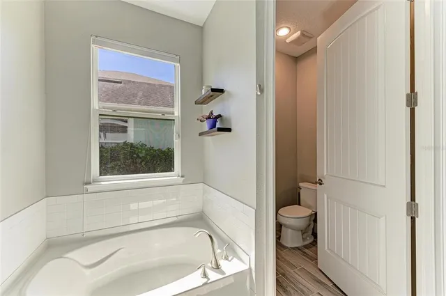 a bedroom with furniture and a baby crib