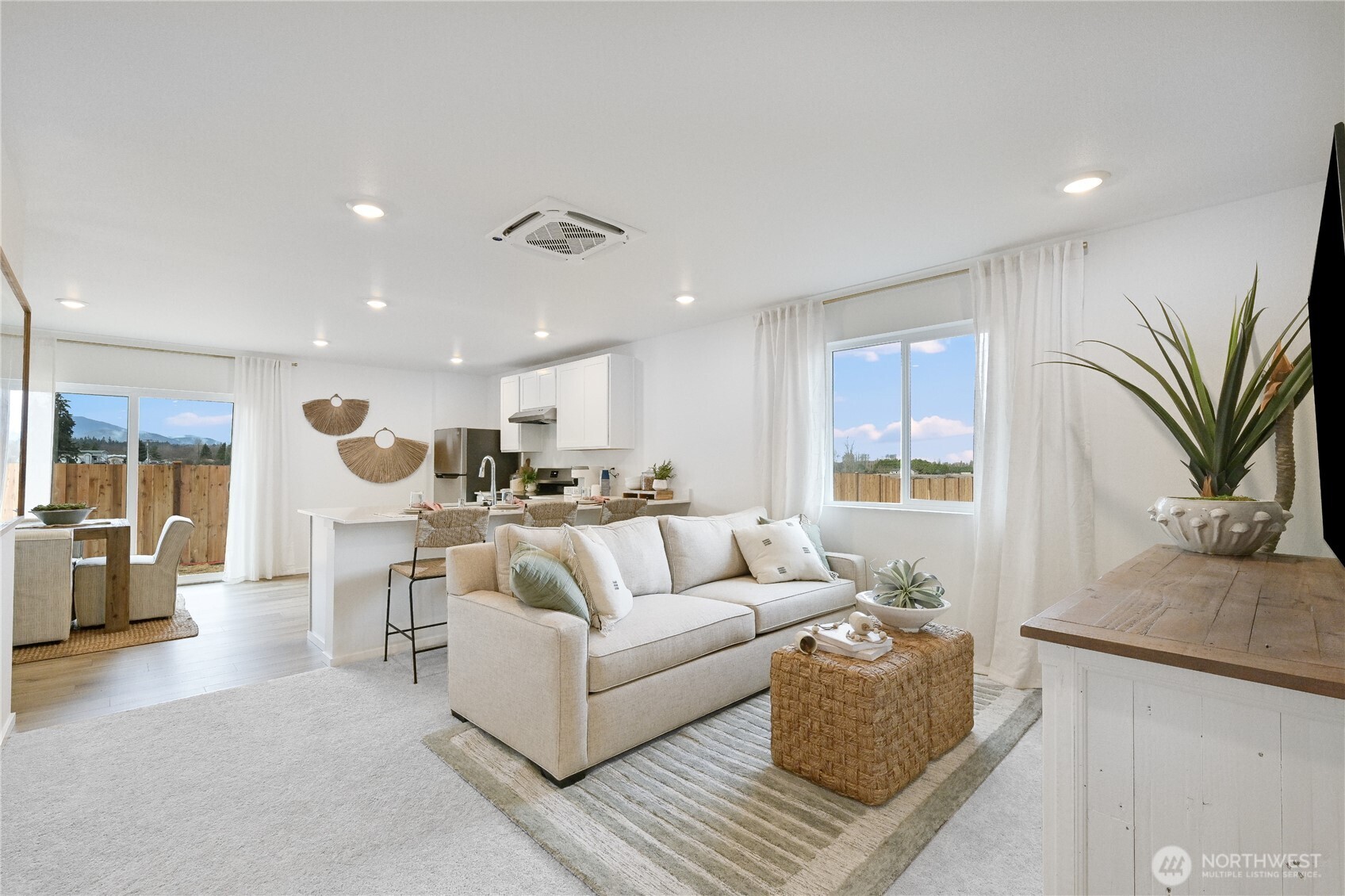 83 Moonshadow Lane Sequim, WA 98382 - Photo 12 of 22 a living room with furniture and a potted plant