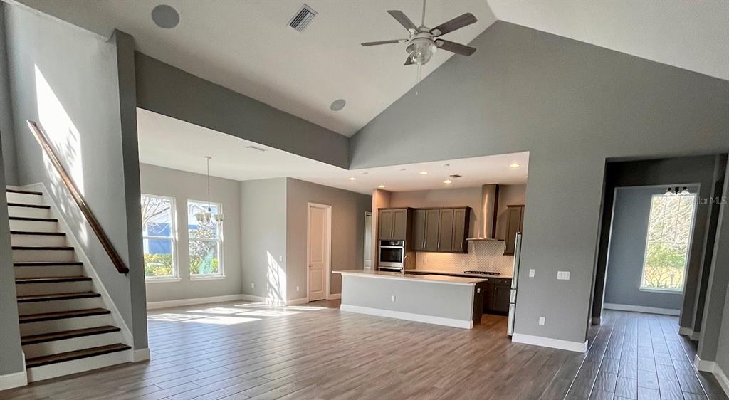 5901 Nature Ridge Lane Lithia, FL 33547 - Photo 13 of 54 a view of a hallway with wooden floor and staircase