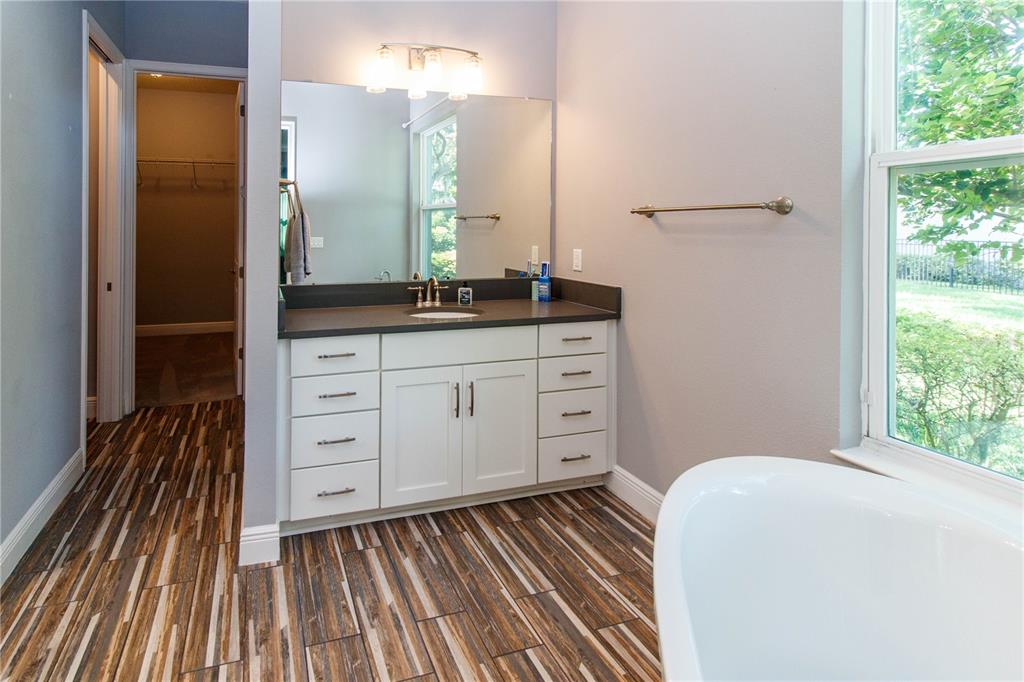 5901 Nature Ridge Lane Lithia, FL 33547 - Photo 25 of 51 a spacious bathroom with a double vanity sink and a mirror