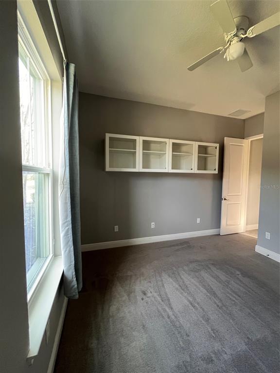 5901 Nature Ridge Lane Lithia, FL 33547 - Photo 32 of 54 a view of an empty room with a window and wooden floor