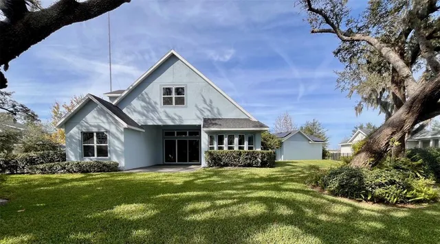 a view of an empty room with large windows