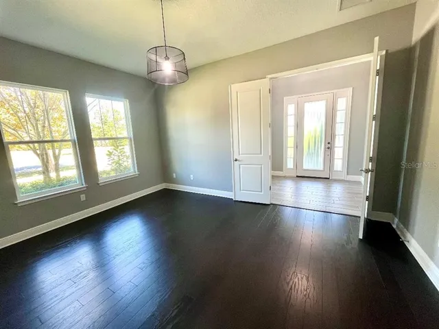a kitchen with stainless steel appliances a sink and a large window