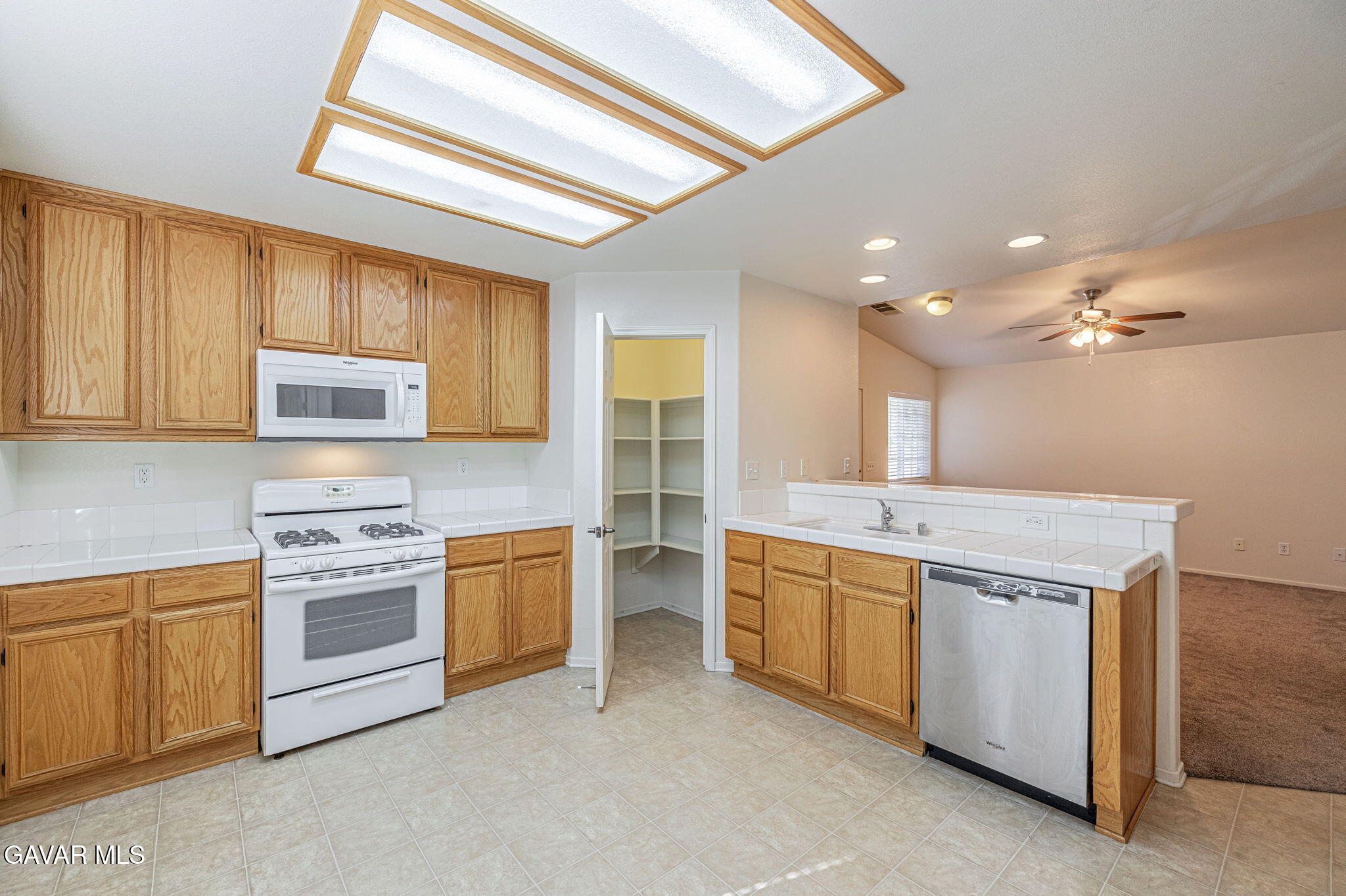 2400 Sunset Ridge Drive Rosamond, CA 93560 - Photo 11 of 34 a kitchen with a stove oven and sink