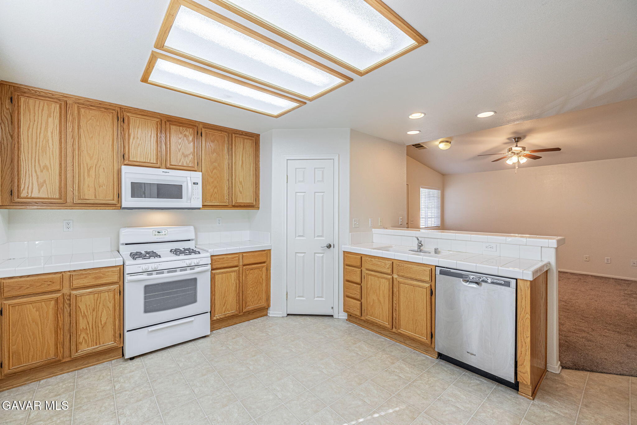 2400 Sunset Ridge Drive Rosamond, CA 93560 - Photo 12 of 34 a kitchen with stainless steel appliances granite countertop a stove and a sink
