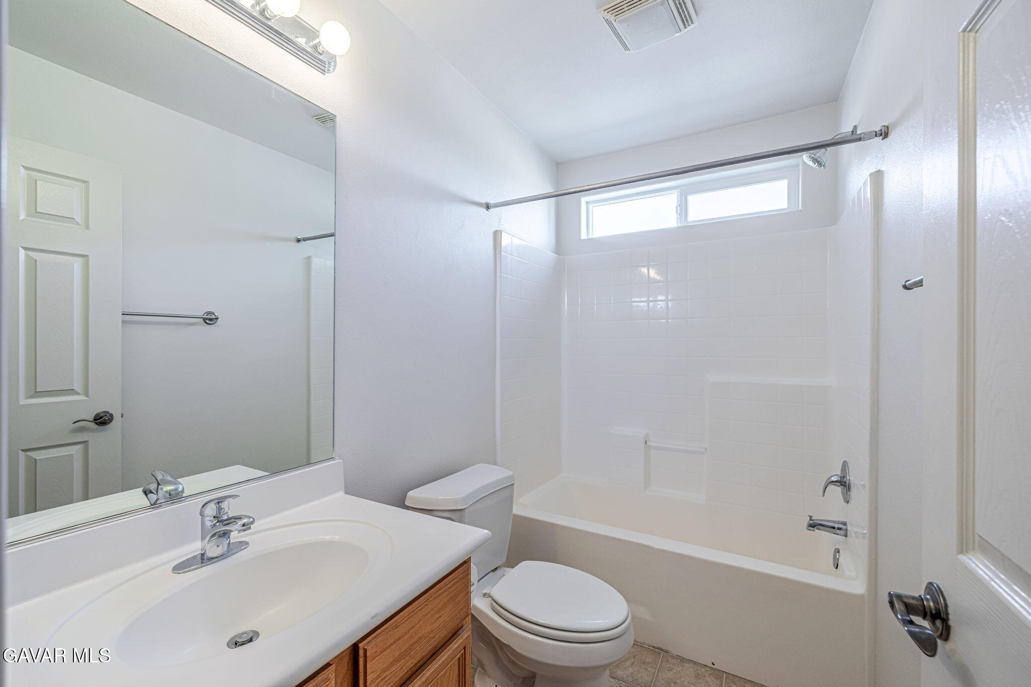 2400 Sunset Ridge Drive Rosamond, CA 93560 - Photo 14 of 34 a bathroom with a bathtub shower sink vanity and toilet